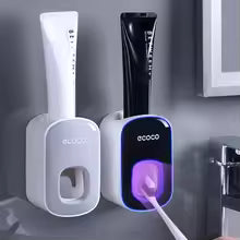 TOOTHPASTE DISPENSER WITH TOOTHBRUSH HOLDER